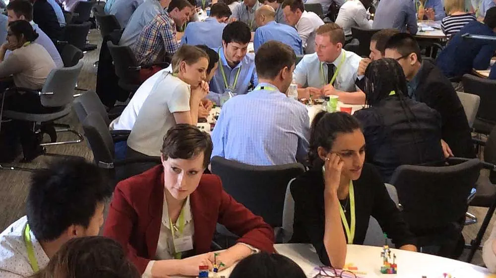 150 delegates at work at a rail industry conference
