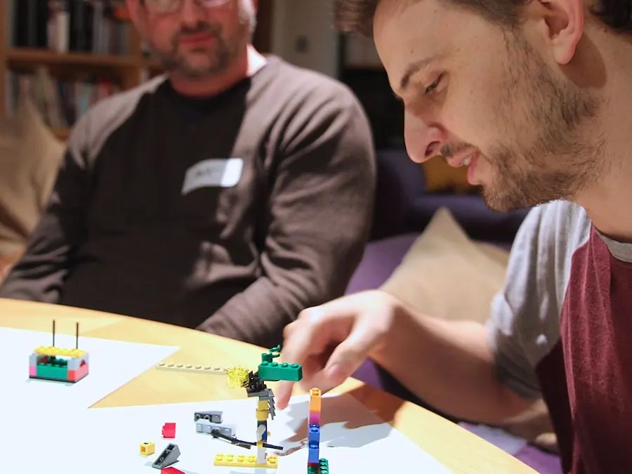 A participant adding to a shared LEGO system model